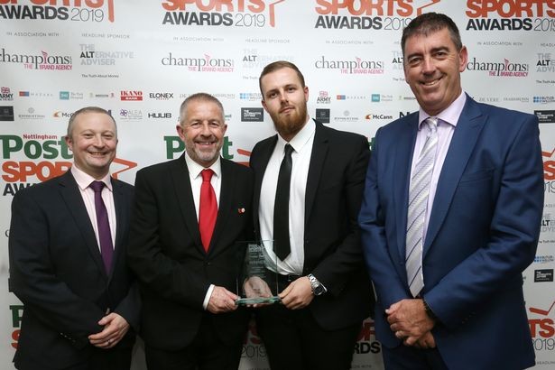 Winners of the Service to the Community award Nottingham Forest Community Trust, represented by Graham Moran and Callum Elliott (centre) pictured with category sponsor Dom Sweeney (left) and Darren Bicknell.